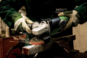 A man is doing a precision sheet metal fabrication at Stuttgart Manufacturing